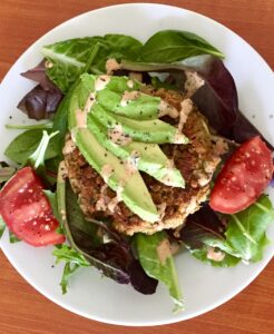 Salad topped with Easy Chickpea Veggie Burger Patty