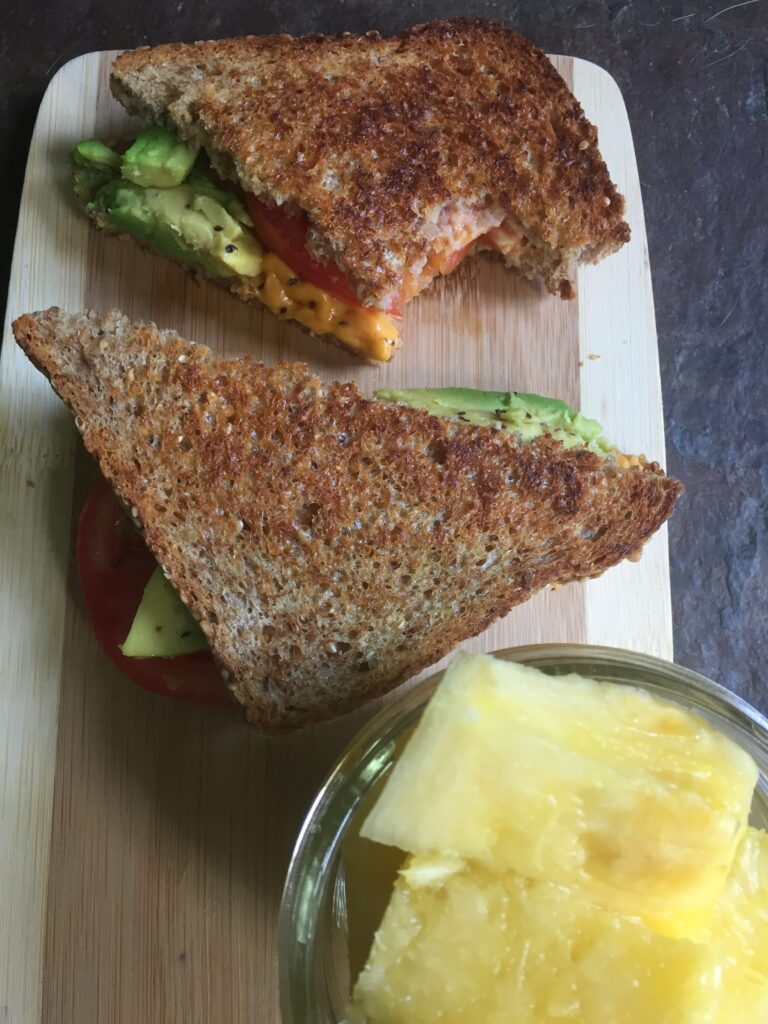 Grilled Avocado, tomato, and cheese sandwich with 1/2 cup side of pineapple Quick and Cheap Vegan Meals courtesy of Vegan Fit Carter