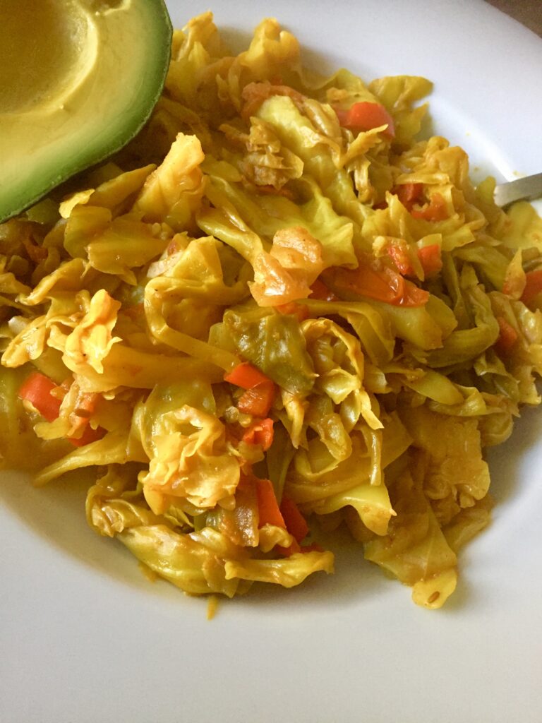 Indian-Style Cabbage with a side of avocado
