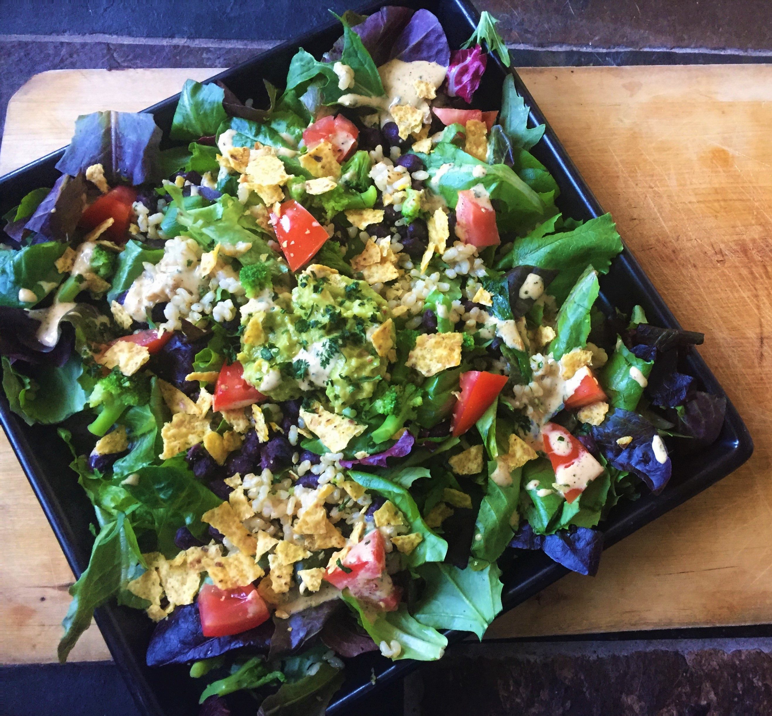 Fiesta Burrito Salad with Cheesy Chipotle Lime dressing recipe courtesy of the Vegan Fit Carter food and fitness blog