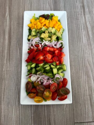 Strawberry Mango Romaine Salad with Raspberry Vinaigrette recipe courtesy of That Green Lyfe